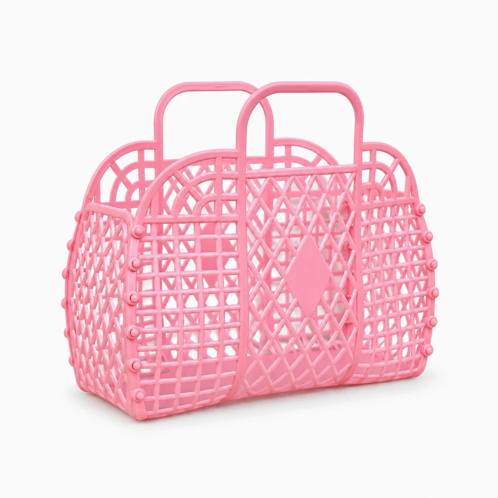 Panier de douche rose ajouré avec deux anses pour la salle de bain