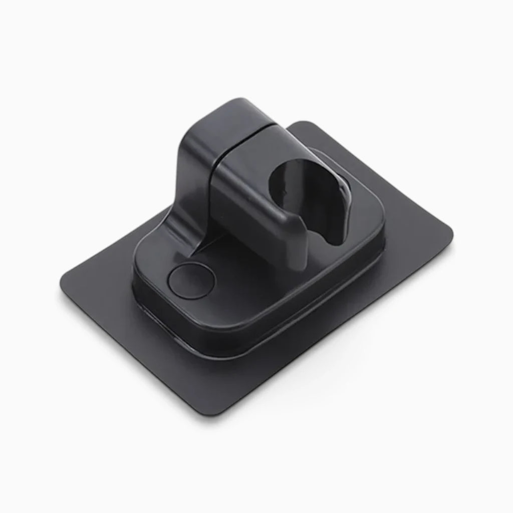 Support de douche orientable en métal argenté maintenant fermement le pommeau
