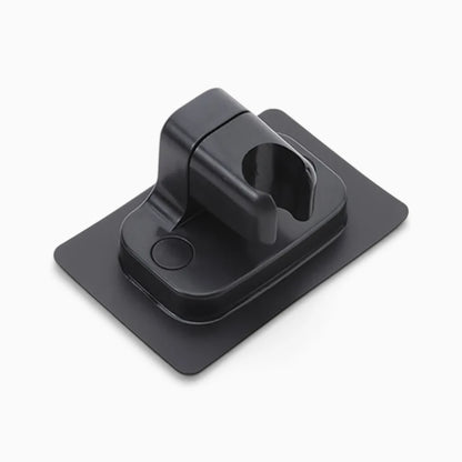 Support de douche orientable en métal argenté maintenant fermement le pommeau