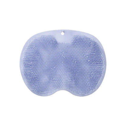 Tapis exfoliant silicone antidérapant posé au sol de salle de bain humide
