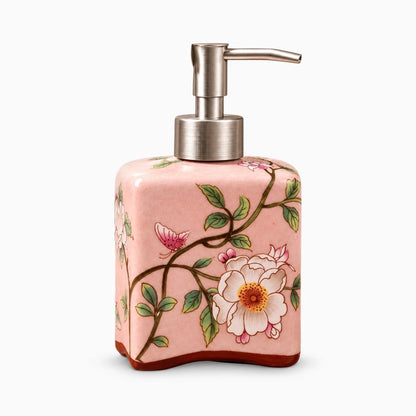 Flacon distributeur savon en porcelaine arrondi posé sur lavabo