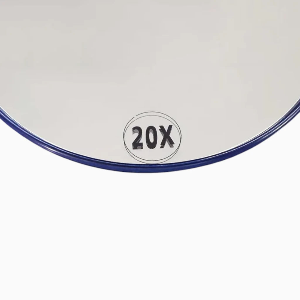 Miroir grossissant à ventouse en position fixe, révélant détails fins du visage