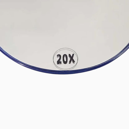 Miroir grossissant à ventouse en position fixe, révélant détails fins du visage