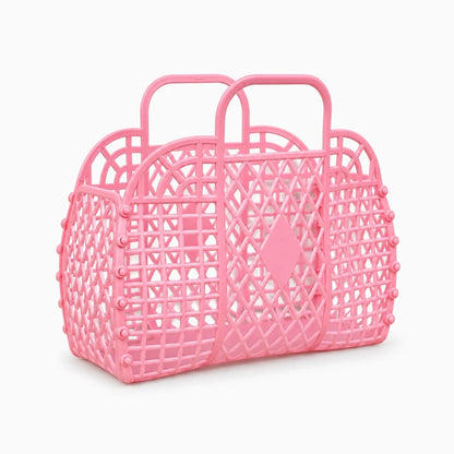 Panier de douche rose ajouré avec deux anses pour la salle de bain
