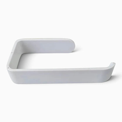 Porte papier toilette autocollant blanc fixé sur carrelage près des toilettes