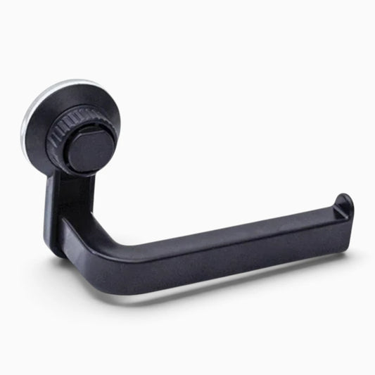 Porte papier toilette à ventouse fixé sur carrelage blanc près des toilettes