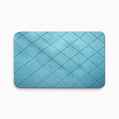 Tapis de pierre salle de bain utilisé près du lavabo pour un sol sec et confortable