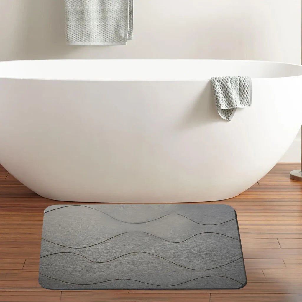 Tapis de bain en pierre installé dans une salle de bain